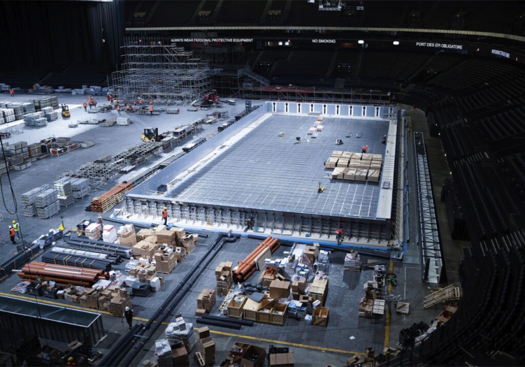 Pool basin under construction inside an arena